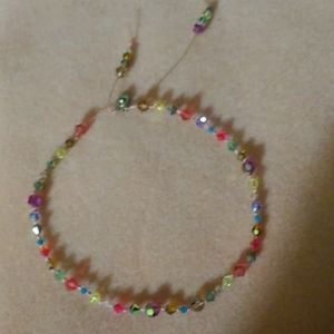 Handmade by published designer in 100% silk cord.